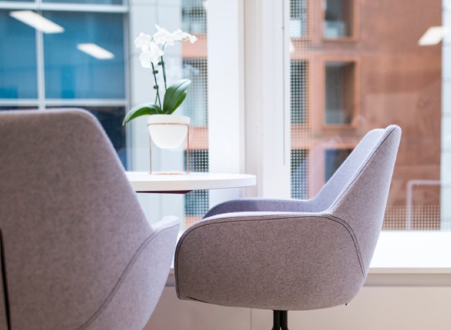 close up of comfortable chairs around a table