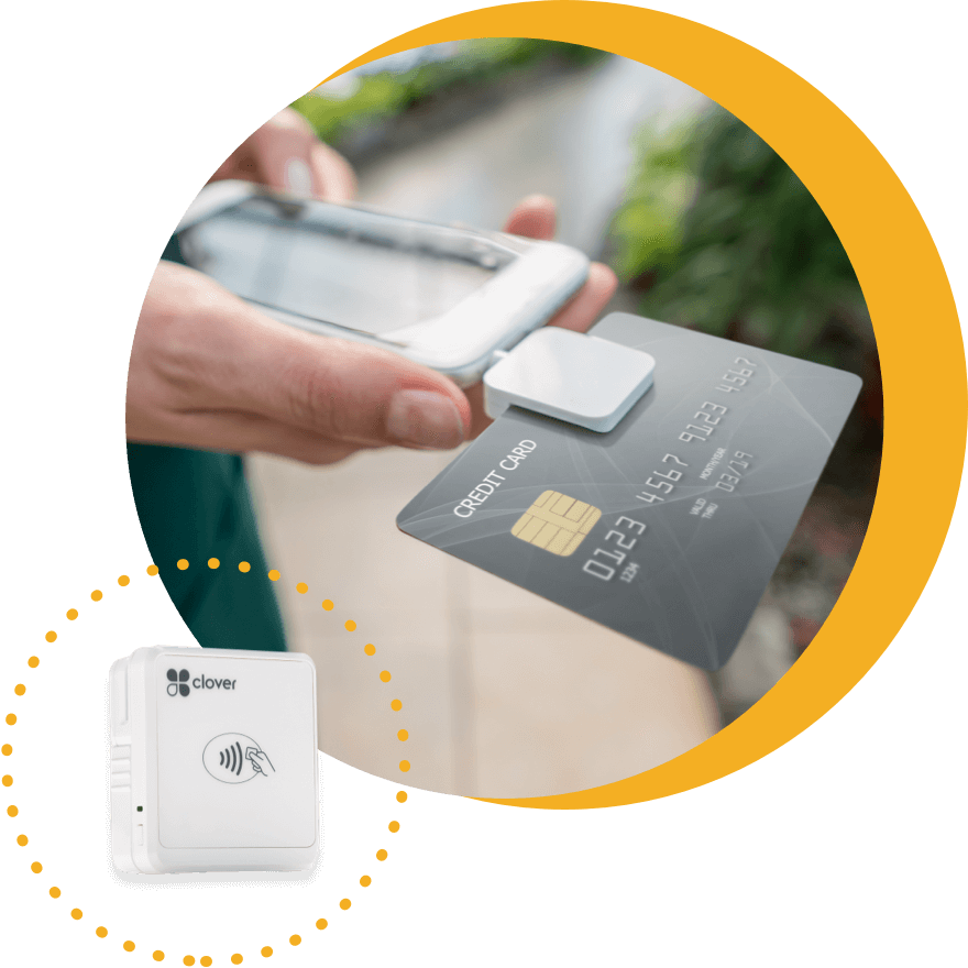 Clover mobile payment processing accessory attached to smart phone.