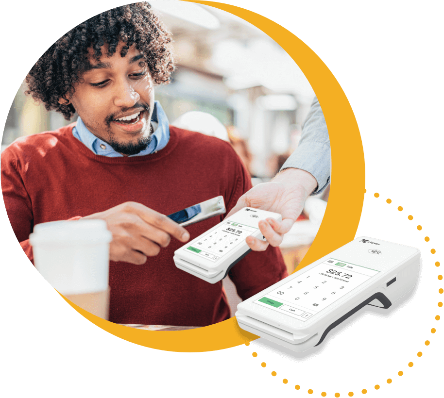 Customer using processing terminal to pay with credit card.